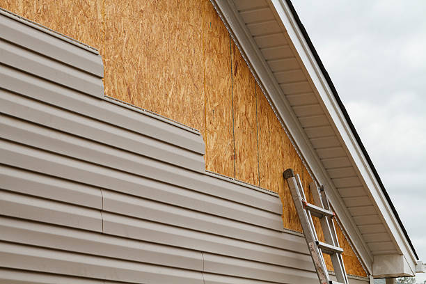 Professional Storm Damage Siding Repair technician working in Apple Creek, OH